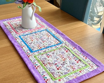 Pink wildflowers quilted table runner. Spring Summer