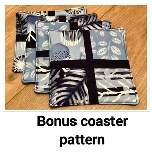 May include: Four blue and black fabric coasters with a geometric pattern. The coasters are stacked on top of each other. Bonus coaster pattern.
