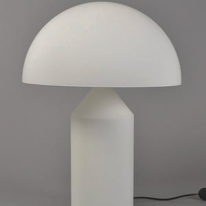 May include: A white table lamp with a dome-shaped shade and a cylindrical base.