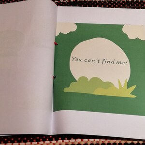 May include: A green book with a white circle and the text "You can't find me!" on the cover.