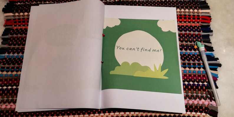 May include: A green book with a white circle and the text "You can't find me!" on the cover.