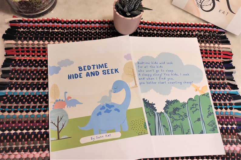 May include: A children's book titled "Bedtime Hide and Seek" with a blue dinosaur and a yellow dinosaur on the cover. The text reads "Bedtime hide and seek for all the kids who won't go to sleep. A sleepy story! You hide, I seek and when I find you, you better start counting sheep!"  The book is by Sunn Kat.