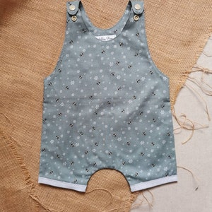 Tutina corta in cotone color verde acqua Bumble Bee. Da 0 a 6 anni.