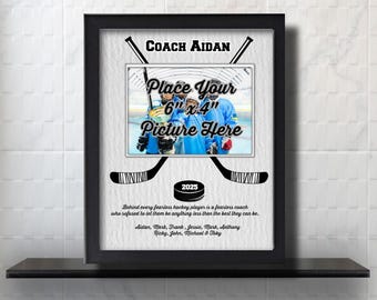 May include: A black framed photo with a hockey theme. The photo has a space for a 6x4 inch picture. The text reads "Coach Aidan" and "Place Your 6"x4" Picture Here". The year 2025 is printed below the picture space. A quote about a fearless coach is printed below the year.