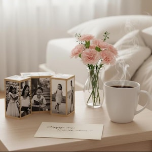 Könnte beinhalten: Ein Set aus drei Keramikbechern mit gesprenkelter, matter Oberfläche. Die Becher sind in Creme-, Hellgrau- und Dunkelgrautönen gehalten. Jeder Becher hat ein schlichtes, minimalistisches Design.