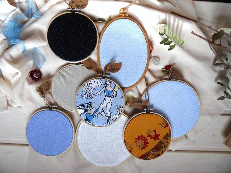 May include: A set of three ceramic nesting bowls in shades of blue, green, and white. The bowls feature a speckled glaze and a simple, modern design. The largest bowl measures approximately 6 inches in diameter.