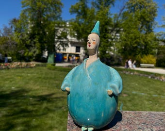 ceramic sculpture of a turquoise Mr. Balloon, ceramic handmade sculpture