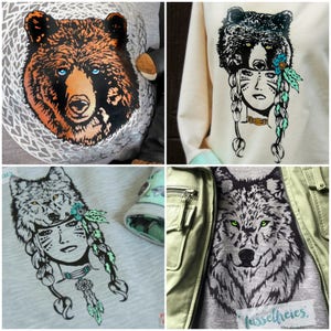May include: Three different designs for a t-shirt featuring a wolf, a bear, and a woman wearing a wolf headdress. The designs are in black and white with green accents. The text "fussefrei.es Handmade" is visible on the bottom right of the image.