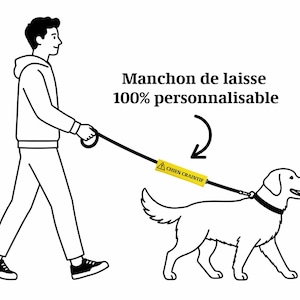 May include: A black and white illustration of a person walking a dog on a leash. The leash has a yellow tag that reads "CHIEN CRAINTIF". The text "Manchon de laisse 100% personnalisable" is also present.