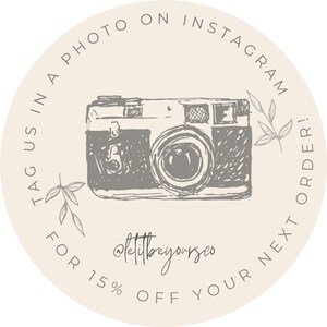 May include: A beige circle with a vintage camera illustration and the text "Tag us in a photo on Instagram for 15% off your next order!" and the text "@littlebyourseo".