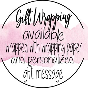 May include: A pink watercolor circle with a black outline and the text "Gift Wrapping available wrapped with wrapping paper and personalized gift message".