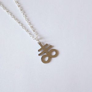 Stainless steel Leviathan cross symbol with silver plated necklace. 18 inch chain.