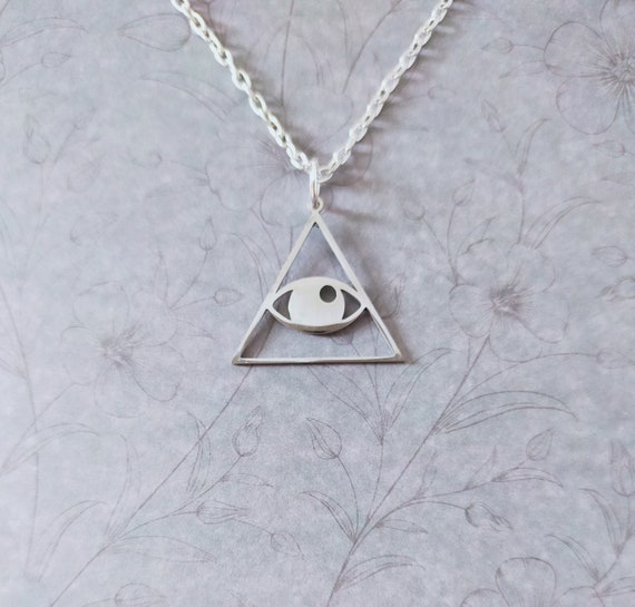 Illuminati symbol stainless steel pendant on a silver plated pendant necklace. 20 inch chain