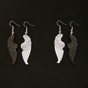 Black and white angel and demon wing mismatched earrings. Good and evil. Heaven and hell