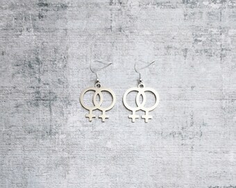 Double venus silver plated drop earrings.