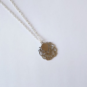 Stainless steel Cthulhu symbol with silver plated pendant 18 inch chain.