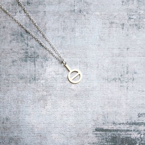 Stainless steel Agender pride symbol with a silver plated 18 inch  chain.