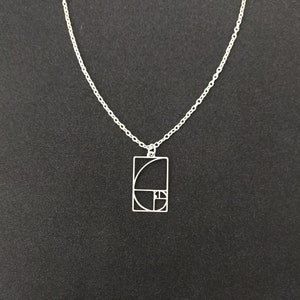 Stainless steel Fibonacci golden spiral pendant with silver plated 18 inch chain. Mathematics. Esoteric. Golden ratio.