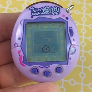 2004 Tamagotchi Connection Light Purple With Pink and Purple