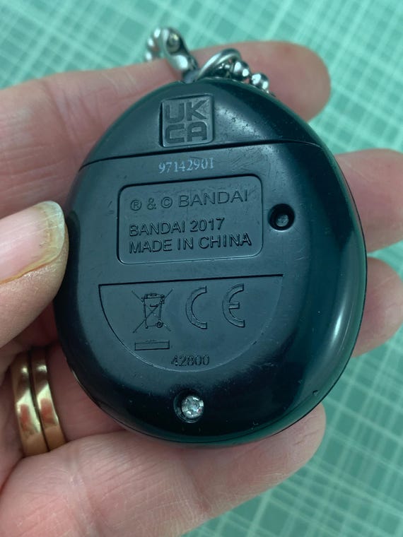 Bandai Tamagotchi Black With Dark Purple and Pink Flames