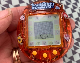 たまごっちコネクション　オレンジフラワー バンダイ 2004 2004 Bandai Tamagotchi Connection Crystal Transparent/clear
