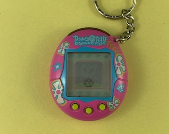 2004 Bandai Tamagotchi Connection Dark Fuchsia Pink with White and Blue Flowers