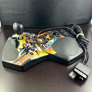 May include: A white ceramic mug with a black handle and the text "But First, Coffee" in a black, handwritten-style font. The mug is on a white surface.