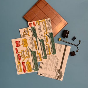 Heroclix Adventure Kit - Outdoor Set: lamppost, mailbox, crate, and dumpster, Map and 3 Double Sided Senario Cards
