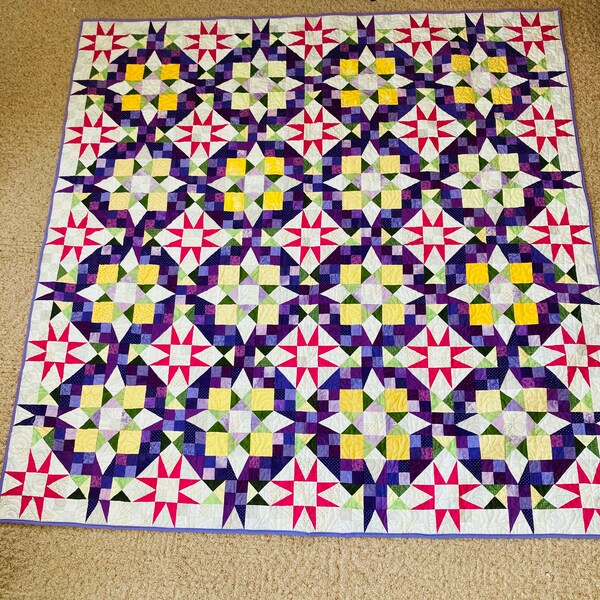 Large purple pink yellow scrappy quilt