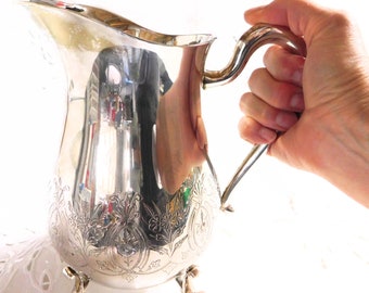 Vintage Silver-plated Water Pitcher with Engraved Design and Four Feet by Leonard Silver Company