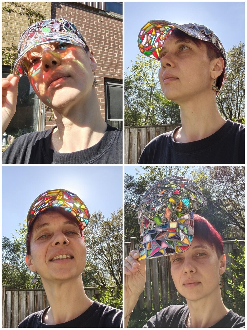 May include: A unique baseball cap with a stained glass design. The cap features a mosaic of colorful glass pieces in various shapes and sizes, creating a vibrant and eye-catching pattern. The cap's brim and crown are made of a silver material.