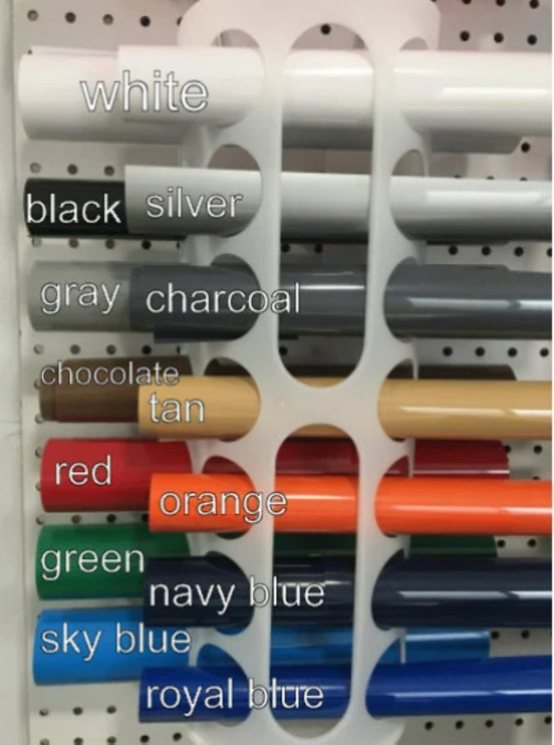 May include: A display of paint samples in various colors, including white, black, silver, gray, charcoal, chocolate, tan, red, orange, green, navy blue, sky blue, and royal blue.