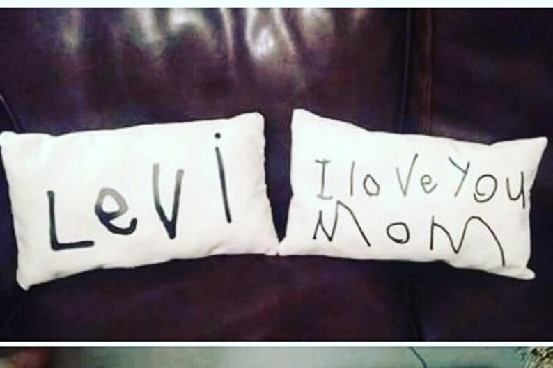 May include: Two white pillowcases with black marker writing. One pillowcase says "Levi" and the other says "I love you Mom".