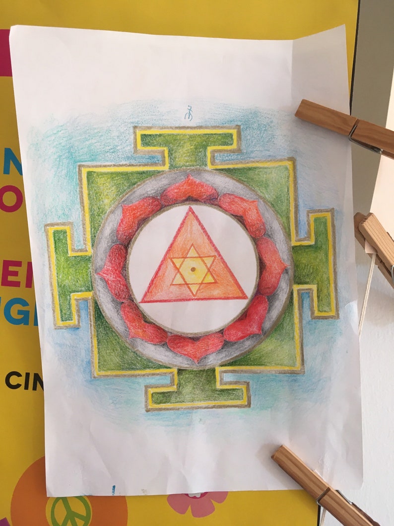 May include: A hand-drawn mandala with a green square frame, a red and orange triangle in the center, and a circle of red petals around the triangle.