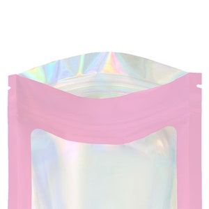 May include: Pink stand-up pouch with a clear window and iridescent holographic top.