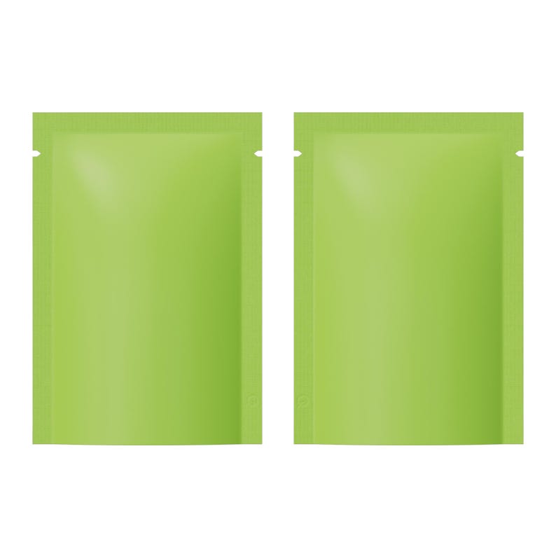 May include: Two vivid green, rectangular sachets with a smooth, glossy finish. Each sachet has a small notch at the top for easy opening. The sachets are side by side, and the background is plain white.