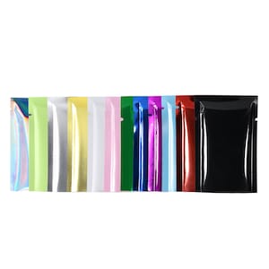 May include: Assortment of 12 colorful foil pouches, each with a different color, including iridescent, green, silver, gold, white, pink, dark green, blue, purple, light blue, red, and black.