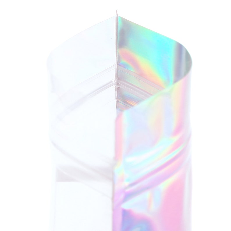 May include: A clear plastic bag with a holographic iridescent finish. The bag is folded in half, showing the inside of the bag.