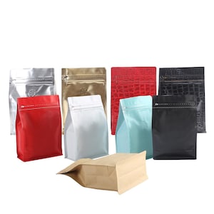 May include: Assortment of stand-up pouches in various colors and textures. Includes silver, gold, red, black, white, and light blue pouches. Some have a textured finish, and all have a zip closure and a degassing valve for freshness.