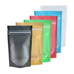 May include: A set of six stand-up pouches with zipper closures. The pouches are made of clear plastic with a metallic finish and come in a variety of colors, including black, gold, green, red, blue, and white.