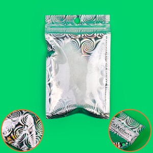 May include: A clear, resealable bag with a silver and green swirled pattern. The top edge has a green border and a small hole for hanging. The bag is empty and set against a bright green background.