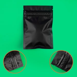 May include: Black stand-up pouch with a zipper closure. The pouch is made of a material that is waterproof and airtight. The pouch is ideal for storing food, coffee beans, or other items that need to be kept fresh.