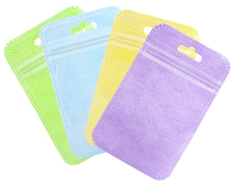 C236 - Paquete de 100 bolsas de tela no tejida con cierre hermético, color pastel y frente transparente