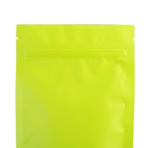 May include: A bright yellow stand-up pouch with a zipper closure. The pouch is made of a shiny, metallic material.
