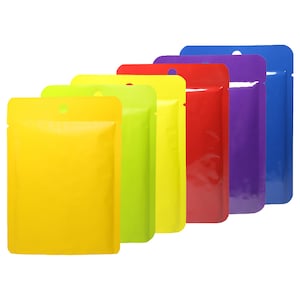 May include: Six stand-up pouches in various colors, including yellow, green, red, purple, and blue. The pouches have a small hole at the top for hanging.