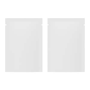 May include: Two white, rectangular, blank pouches with a small notch at the top for easy opening. The pouches are side by side, and the background is plain white.