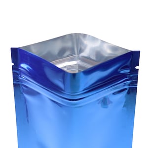 May include: A blue metallic stand-up pouch with a zipper closure. The pouch is made of a shiny, reflective material.