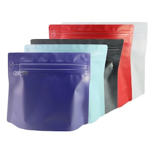 May include: A collection of colorful, stand-up zipper pouches in various shades including blue, light blue, black, red, and white. Each pouch has a zipper closure and the word "ZIPPER" printed on the front.