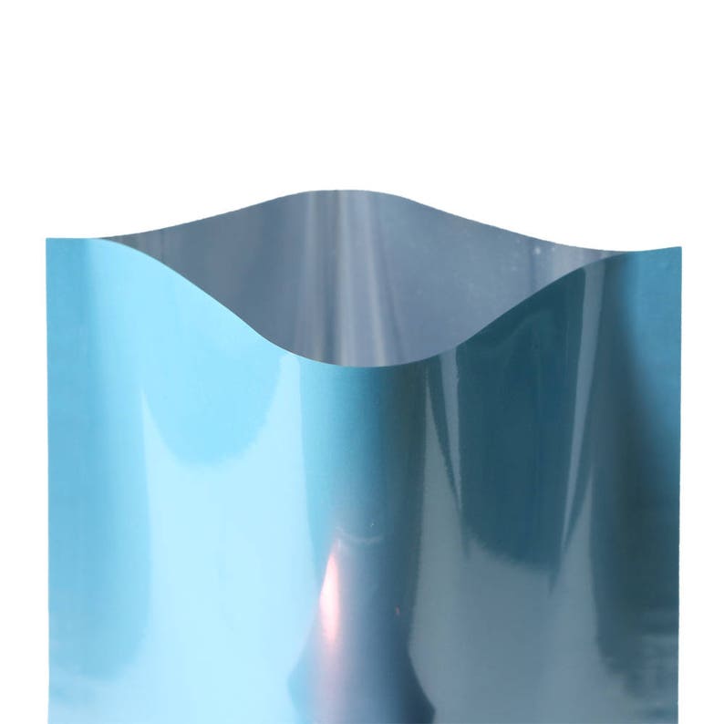 May include: A light blue, metallic, stand-up pouch with a slight curve at the top.