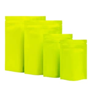 May include: Four different sizes of bright green stand-up pouches with zipper closures. The pouches are made of a shiny, metallic material.